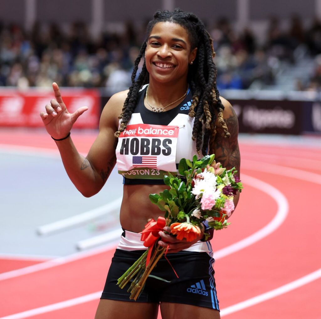 Hobbs holds flowers after competing in the 60m in Houston. 