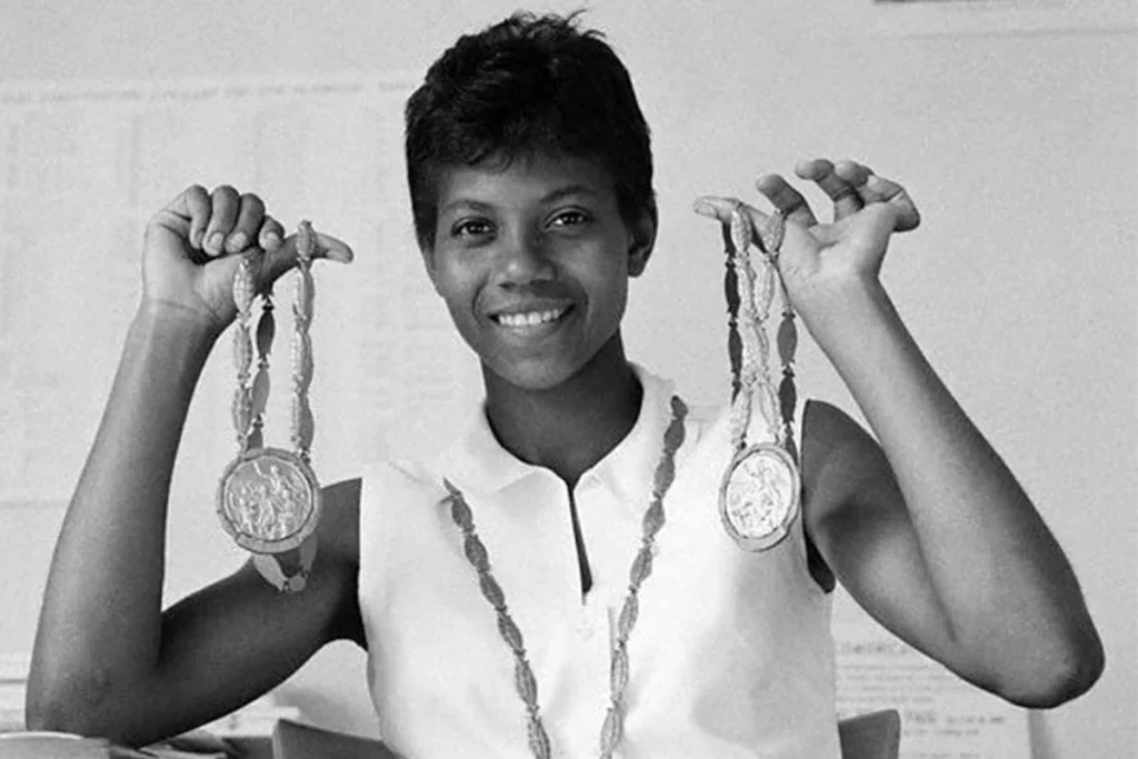 Wilma holding two medals