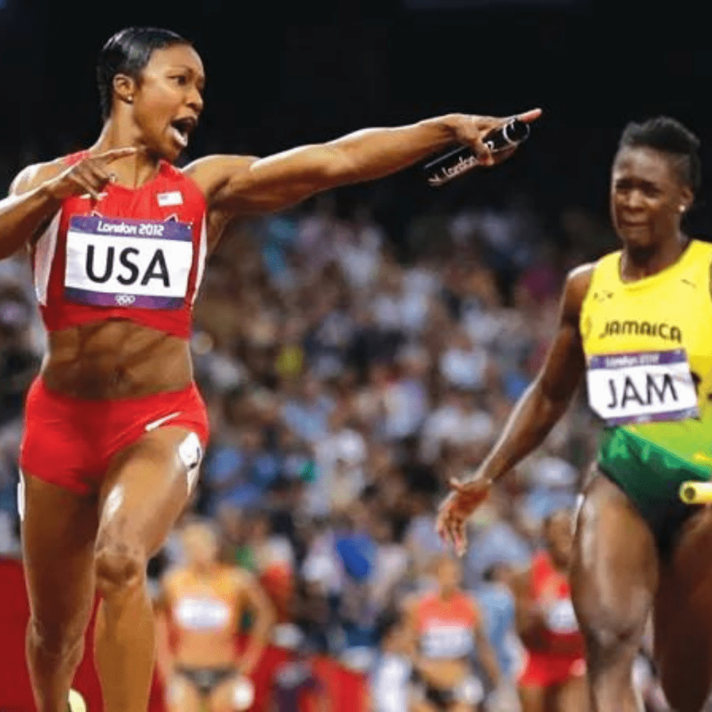 Carmelita Jeter crosses the line at the London 2012 Olympics