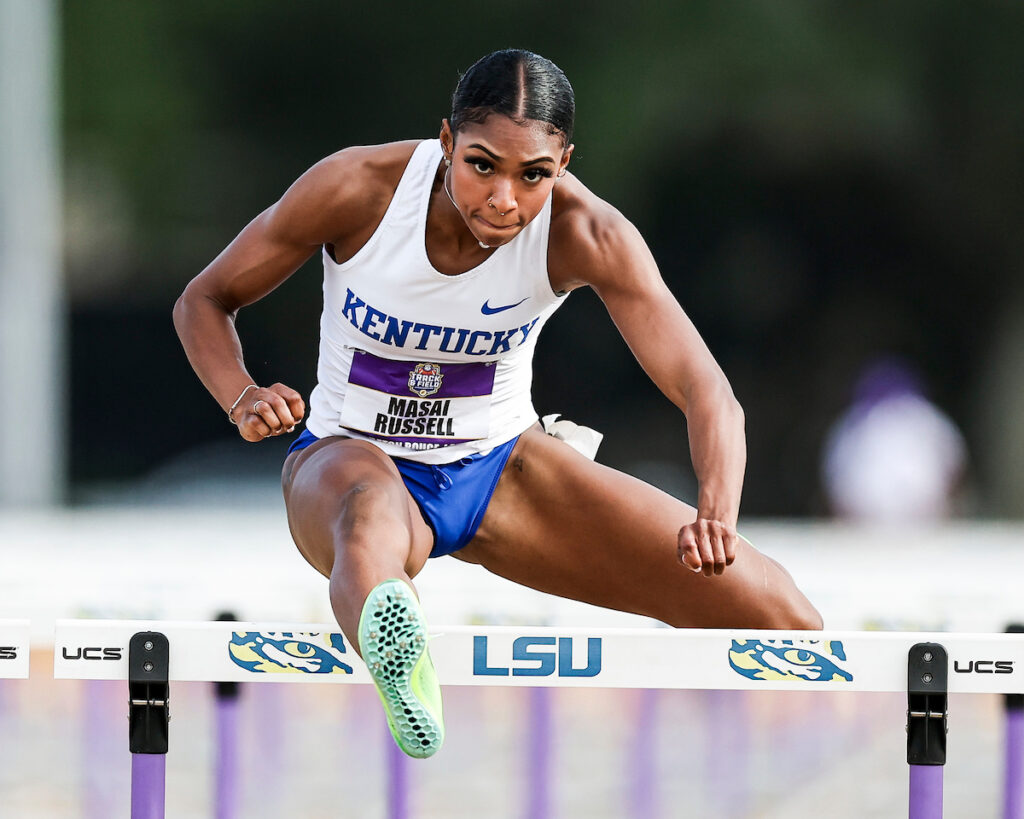 Russell going over a hurdle, representing the University of Kentucky 