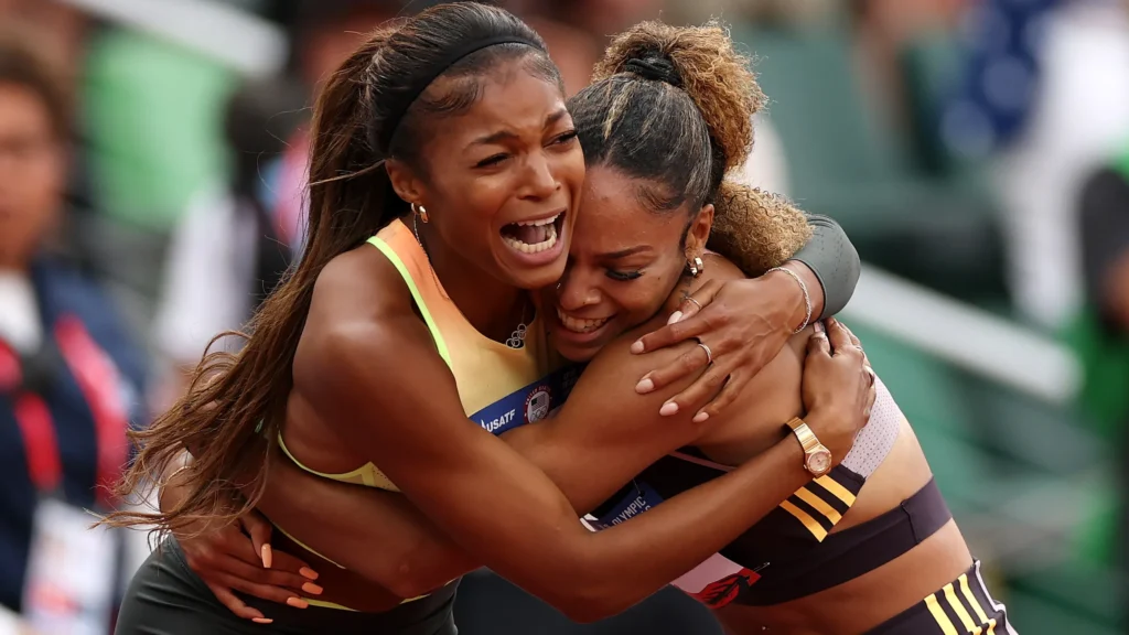 Long hugs Gabby Thomas as they both make the USA Olympic Team