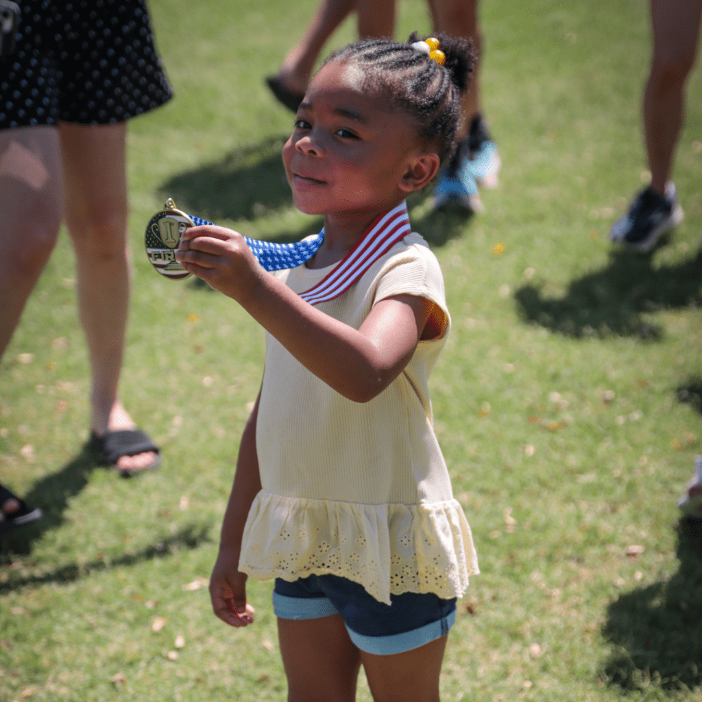 Girls holds a medal