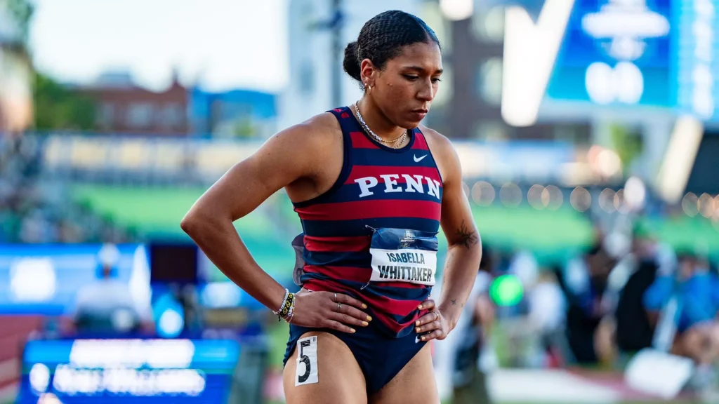 Isabella stands ready behind her blocks prior to her race