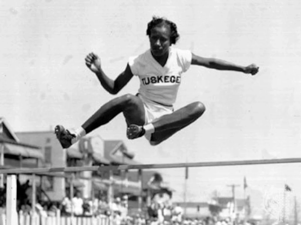 Coachman competing in the high jump