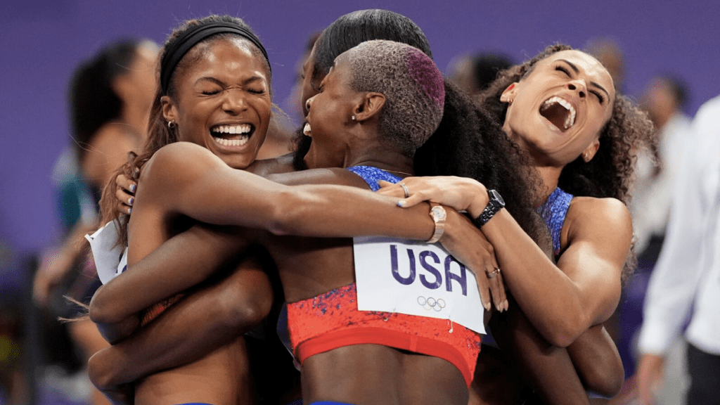 Team USA’s 2024 4x400m relay team celebrating after securing their gold medals