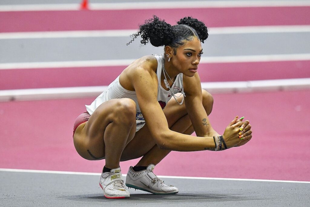 Glenn ponders on the high jump run way prior to taking her jump 