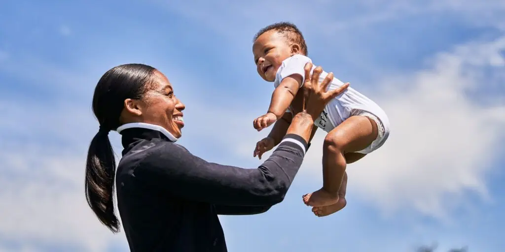 Felix holds her child