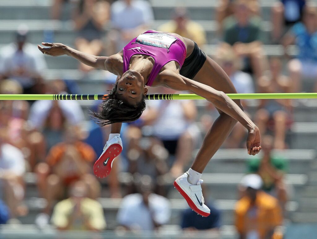 Lowe jumps over the high jump bar