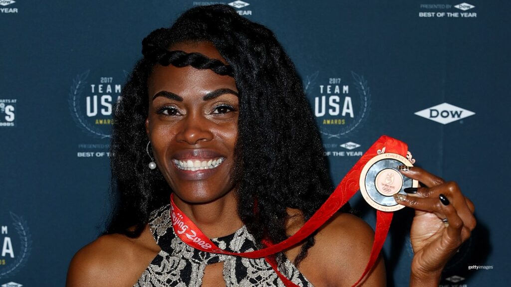 Lowe poses with her medal